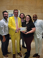 Commerce Bank representatives holding the award.